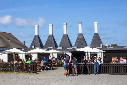 Bornholm, Denmark - August 11, 2020: People in front of Svanke smokehouse.