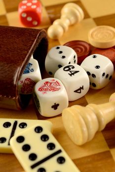 A closeup view of various Classic board game pieces.