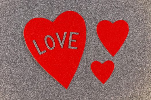 Saint Valentine's day red hearts love design on silver background