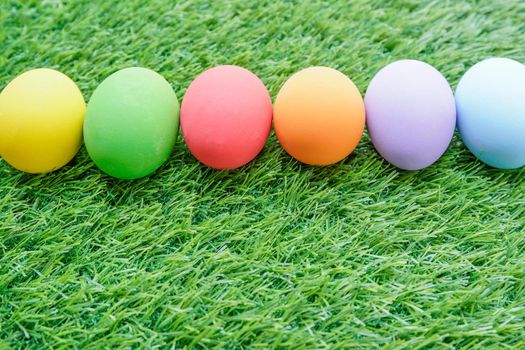 Close up Colorful easter eggs on on green gras background