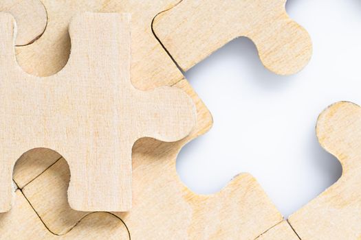 Close up shot of Missing jigsaw puzzle pieces on white background,business concept