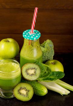 Healthy green smoothie with spinach in a jar mug isolated on white