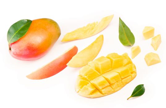 mango slice with green leaves isolated on white background.