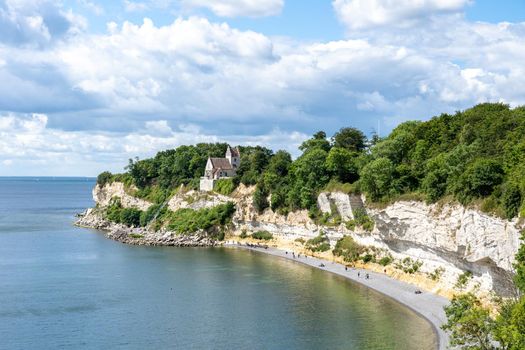 Hojerup, Denmark - July 21, 2020: View of Stevns Klint cliff and the Old Hojerup Church