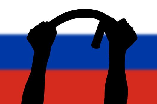 two arms bending police tonfa rubber stick silhouette and blurry russian flag in the background - violent riot control concept