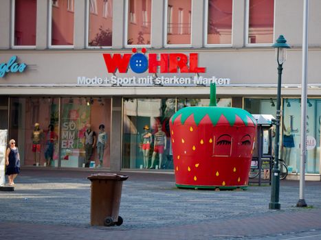 Augsburg, Germany - June 18, 2017: Kiosk for the sale of ice cream in the form of strawberries.