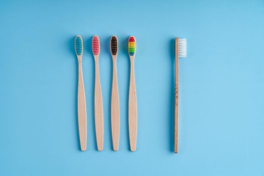 A bunch of eco-friendly bamboo toothbrushes. Global environmental trends. Gender and racial inequality. toothbrushes of different genders.