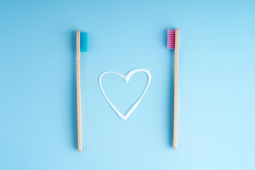 A pair of eco-friendly bamboo toothbrushes. Global environmental trends. Toothbrushes of different genders.