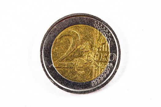 photograph of a two euro coin on a white background