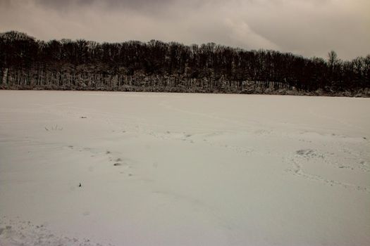 WINTER PANORAMIC PHOTOS FROM A FROZEN POND . High quality photo