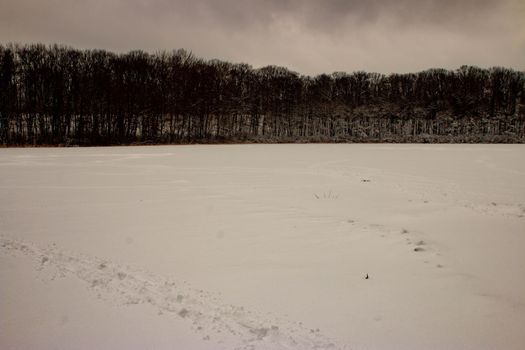 WINTER PANORAMIC PHOTOS FROM A FROZEN POND . High quality photo