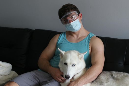 man depressed and hanging out with dog due to covid. High quality photo