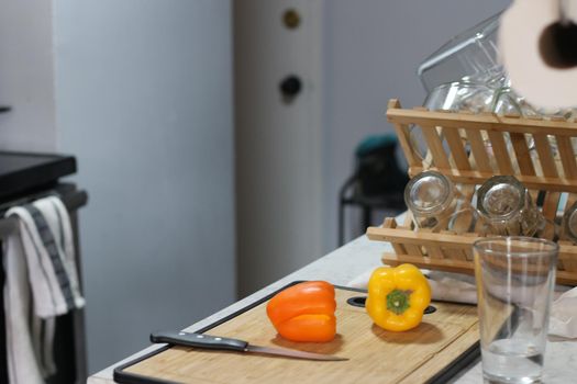 Interior photography, a small modern kitchen ready to cut peppers. High quality photo