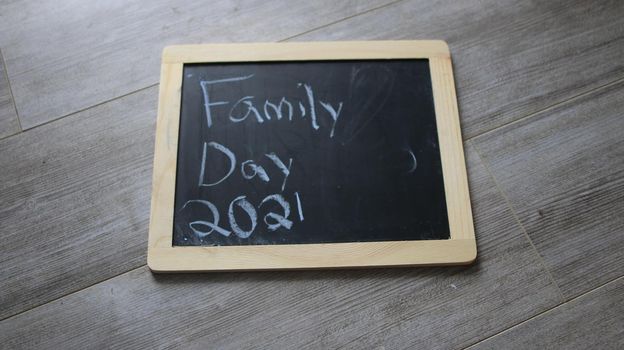 family day 2021 wrote on a chalkboard. High quality photo