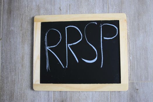RRSP wrote on a chalk board. January is RRSP season . High quality photo