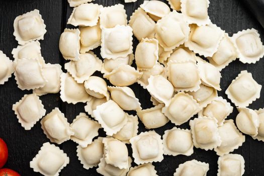Raw Ravioli ingredients set, on black wooden table background