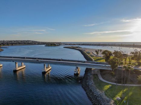  Aerial view of Mission Bay in San Diego, with Ingraham Street bridge during summer sunny day. West Mission Bay drive Bridge famous location in San Diego.