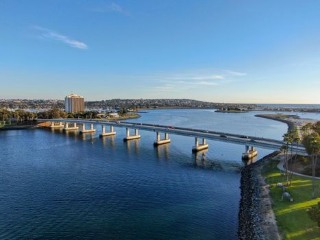  Aerial view of Mission Bay in San Diego, with Ingraham Street bridge during summer sunny day. West Mission Bay drive Bridge famous location in San Diego.