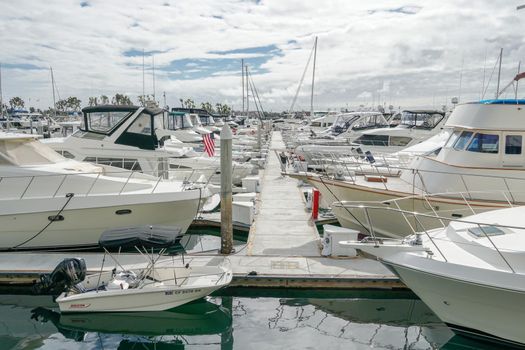 Boats moored at Embarcadero Marina Park North, San Diego. Boat, yachts, ship and sail docked at the harbor. Marina with anchored luxury boats. California. USA. January 16th, 2021