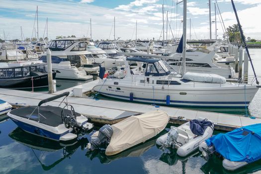 Boats moored at Embarcadero Marina Park North, San Diego. Boat, yachts, ship and sail docked at the harbor. Marina with anchored luxury boats. California. USA. January 16th, 2021