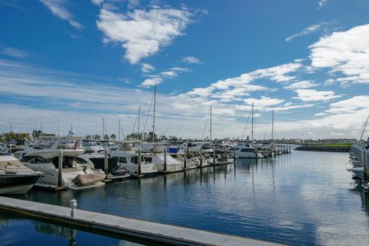 Boats moored at Embarcadero Marina Park North, San Diego. Boat, yachts, ship and sail docked at the harbor. Marina with anchored luxury boats. California. USA. January 16th, 2021