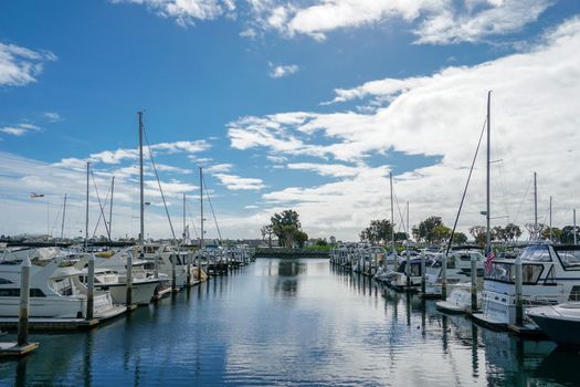 Boats moored at Embarcadero Marina Park North, San Diego. Boat, yachts, ship and sail docked at the harbor. Marina with anchored luxury boats. California. USA. January 16th, 2021