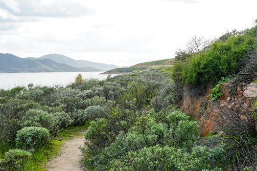 Little trail in Diamond Valley Lake during cloud day. One of the largest reservoirs in Southern California. USA.