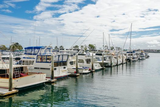 Boats moored at Embarcadero Marina Park North, San Diego. Boat, yachts, ship and sail docked at the harbor. Marina with anchored luxury boats. California. USA. January 16th, 2021