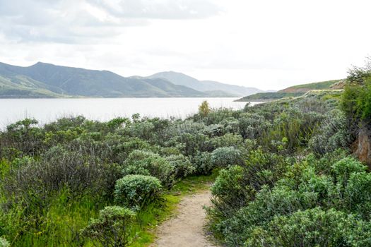 Little trail in Diamond Valley Lake during cloud day. One of the largest reservoirs in Southern California. USA.