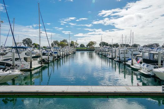 Boats moored at Embarcadero Marina Park North, San Diego. Boat, yachts, ship and sail docked at the harbor. Marina with anchored luxury boats. California. USA. January 16th, 2021