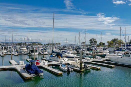 Boats moored at Embarcadero Marina Park North, San Diego. Boat, yachts, ship and sail docked at the harbor. Marina with anchored luxury boats. California. USA. January 16th, 2021