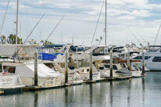 Boats moored at Embarcadero Marina Park North, San Diego. Boat, yachts, ship and sail docked at the harbor. Marina with anchored luxury boats. California. USA. January 16th, 2021