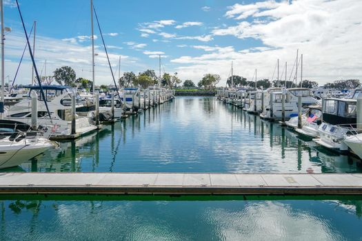 Boats moored at Embarcadero Marina Park North, San Diego. Boat, yachts, ship and sail docked at the harbor. Marina with anchored luxury boats. California. USA. January 16th, 2021