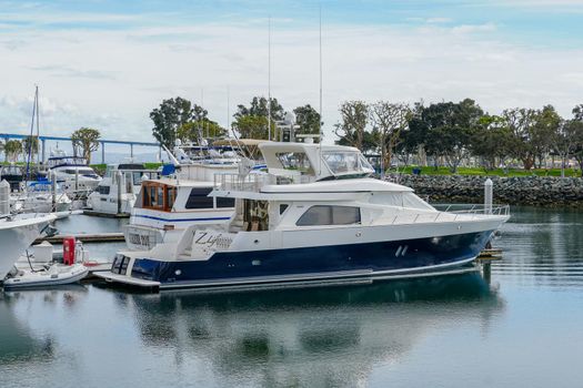 Boats moored at Embarcadero Marina Park North, San Diego. Boat, yachts, ship and sail docked at the harbor. Marina with anchored luxury boats. California. USA. January 16th, 2021