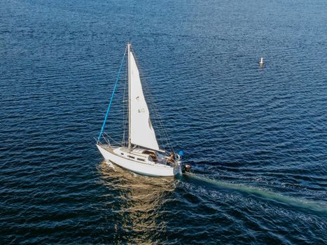 Aerial view of small sail boats in the Mission Bay of San Diego, California, USA. Small sailing ship yachts anchored in the bay. March 22nd, 2020