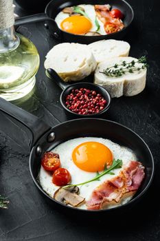Fried Egg with ingredient in cast iron frying pan, on black background