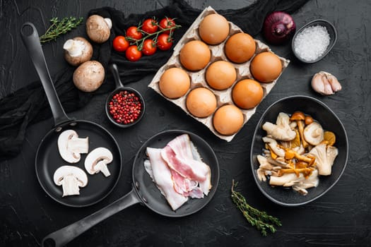 Breakfast egg ingredients mix, on black background, top view flat lay