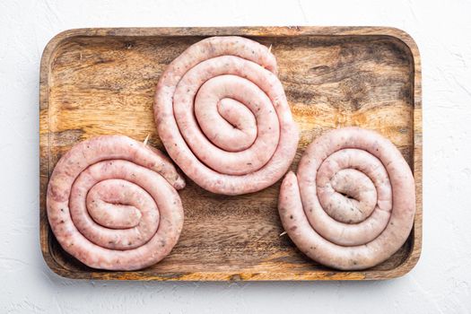 Raw spiral sausage set, on white background, top view flat lay