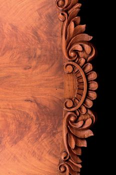 Old wooden table on black background with thread