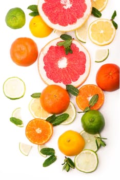 Citrus background. Fresh citrus fruits - Lemons, oranges, limes, grapefruits On wooden background