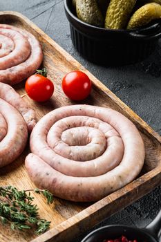 Raw spiral sausage set, on gray background