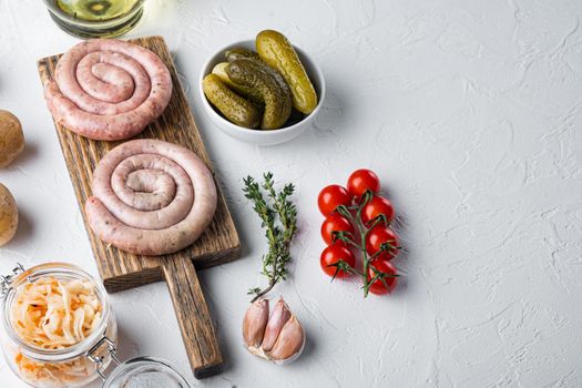 Bavarian fried sausage on sauerkraut, on white background , with space for text copyspace