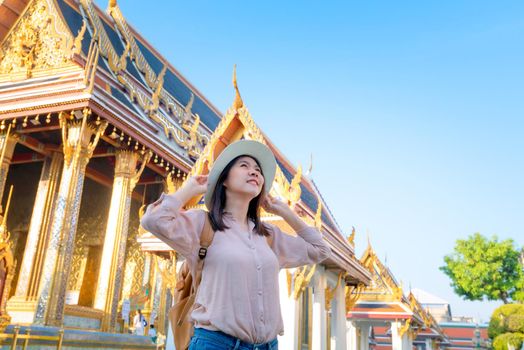 Beautiful asian tourist woman smile and enjoy travel on Vacation in Bangkok at Thailand