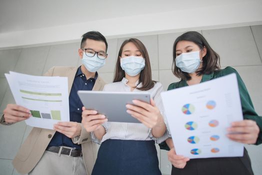 Business employees wearing mask during work in office to keep hygiene follow company policy.Preventive during the period of epidemic from coronavirus or covid19.