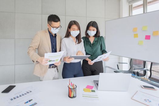 Business employees wearing mask during work in office to keep hygiene follow company policy.Preventive during the period of epidemic from coronavirus or covid19.