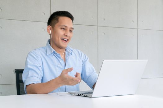 Business man using laptop to video conferencing with colleagues via internet technology at home office.Preventive during the period of epidemic from coronavirus or covid19.