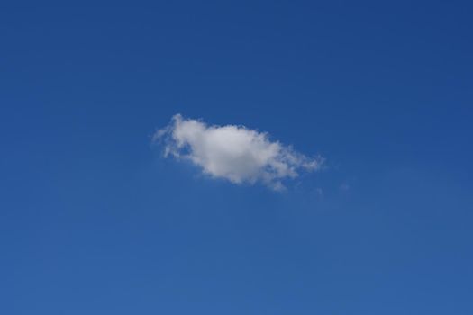 Beautiful cloudscape of nature single white cloud only one on blue sky background in daytime