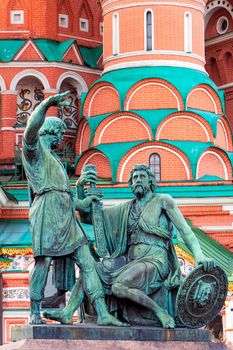 The bronze statue in front of Saint Basil Cathedral at Red Square during sunrise in Moscow at Russia