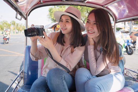 Beautiful asian tourists woman enjoy travel together in urban city downtown on vacation