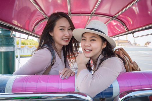 Beautiful asian tourists woman enjoy travel together in urban city downtown on vacation